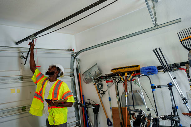 Professional Garage Door Panel Replacement technician working in Rouses Point, NY